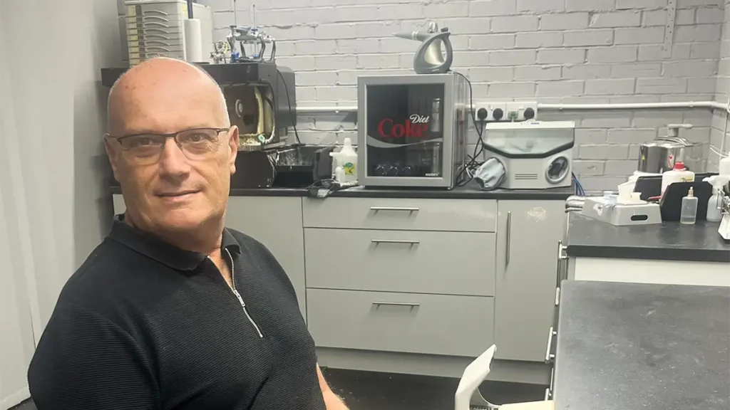 Neil Pettit of NKP Denture Repairs in his denture repair workshop 